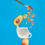 white ceramic mug with silver spoon