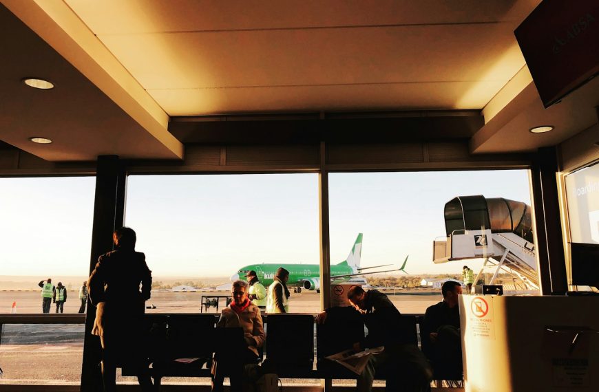 a group of people standing in front of a window