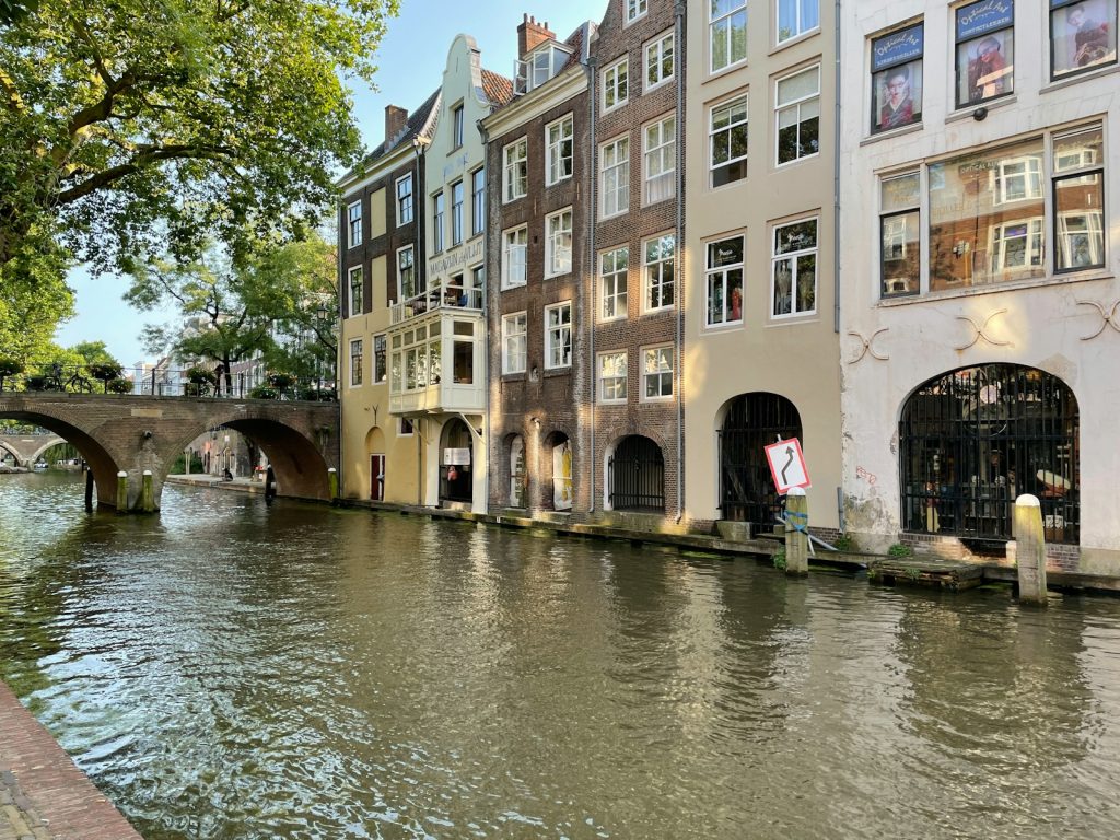 a river running through a city next to tall buildings