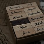 a close up of a wooden block with writing on it