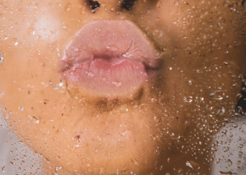 woman in water with water droplets