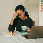 woman in black long sleeve shirt sitting on chair
