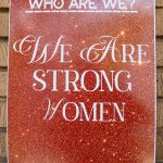 Poster reads 'who are we? we are strong women'.