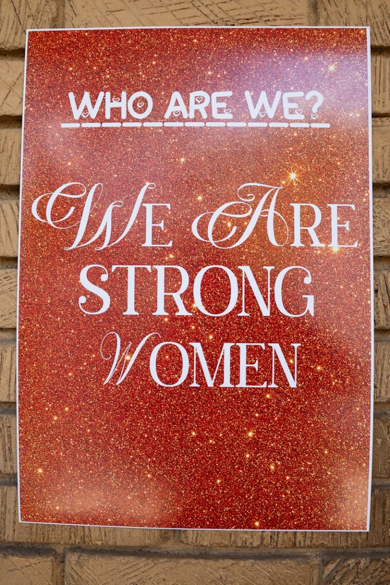 Poster reads 'who are we? we are strong women'.