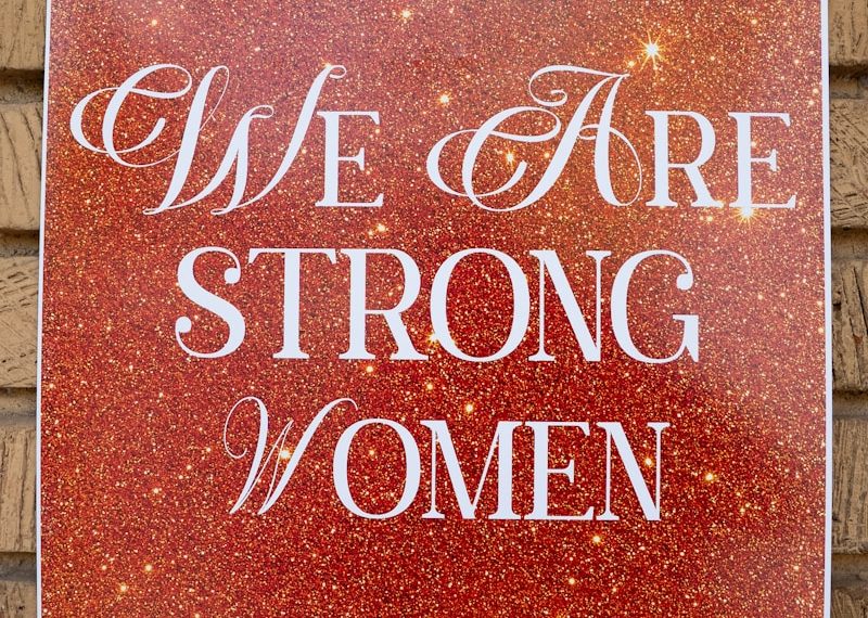 Poster reads 'who are we? we are strong women'.